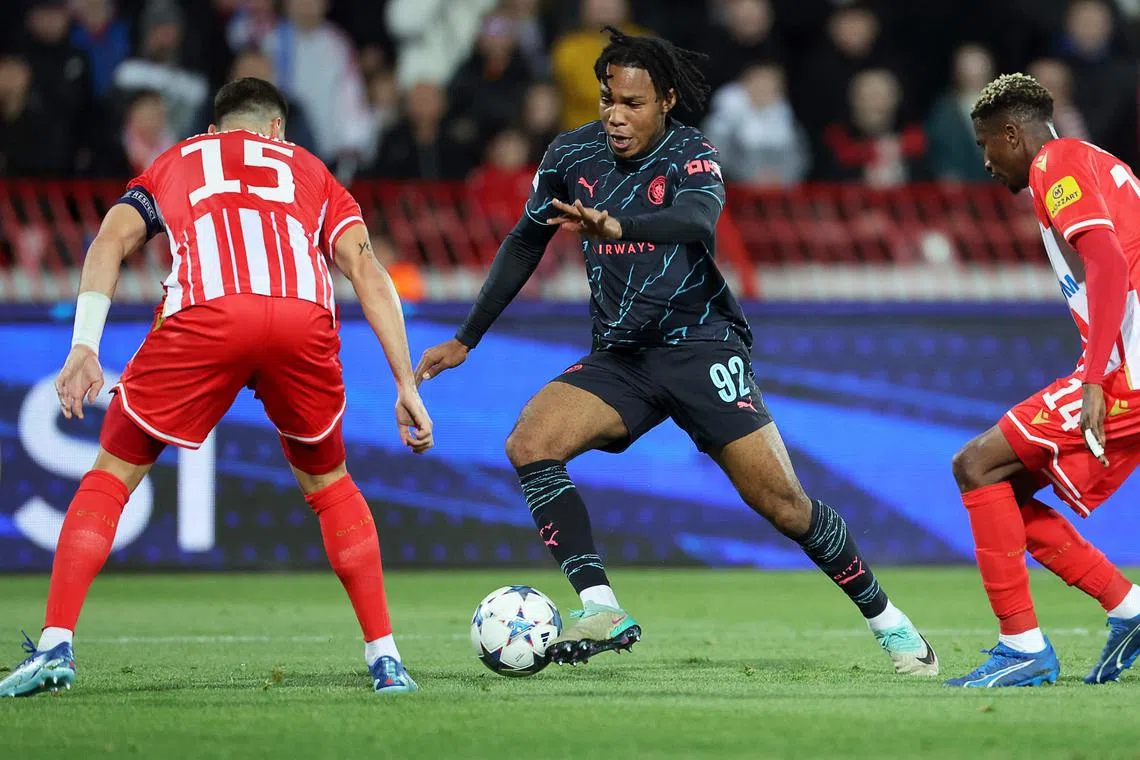 Manchester City's English midfielder #92 Micah Hamilton runs with the ball during the UEFA Champions League Group G day 6 group stage football match between Crvena Zvezda (Red Star Belgrade) and Manchester City at the Red Star stadium in Belgrade, on December 13, 2023. (Photo by PEDJA MILOSAVLJEVIC / AFP)