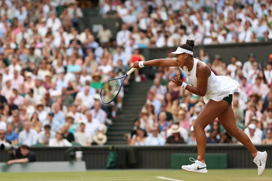 Naomi Osaka serves against Aryna Sabalenka on day seven of Wimbledon 2026.