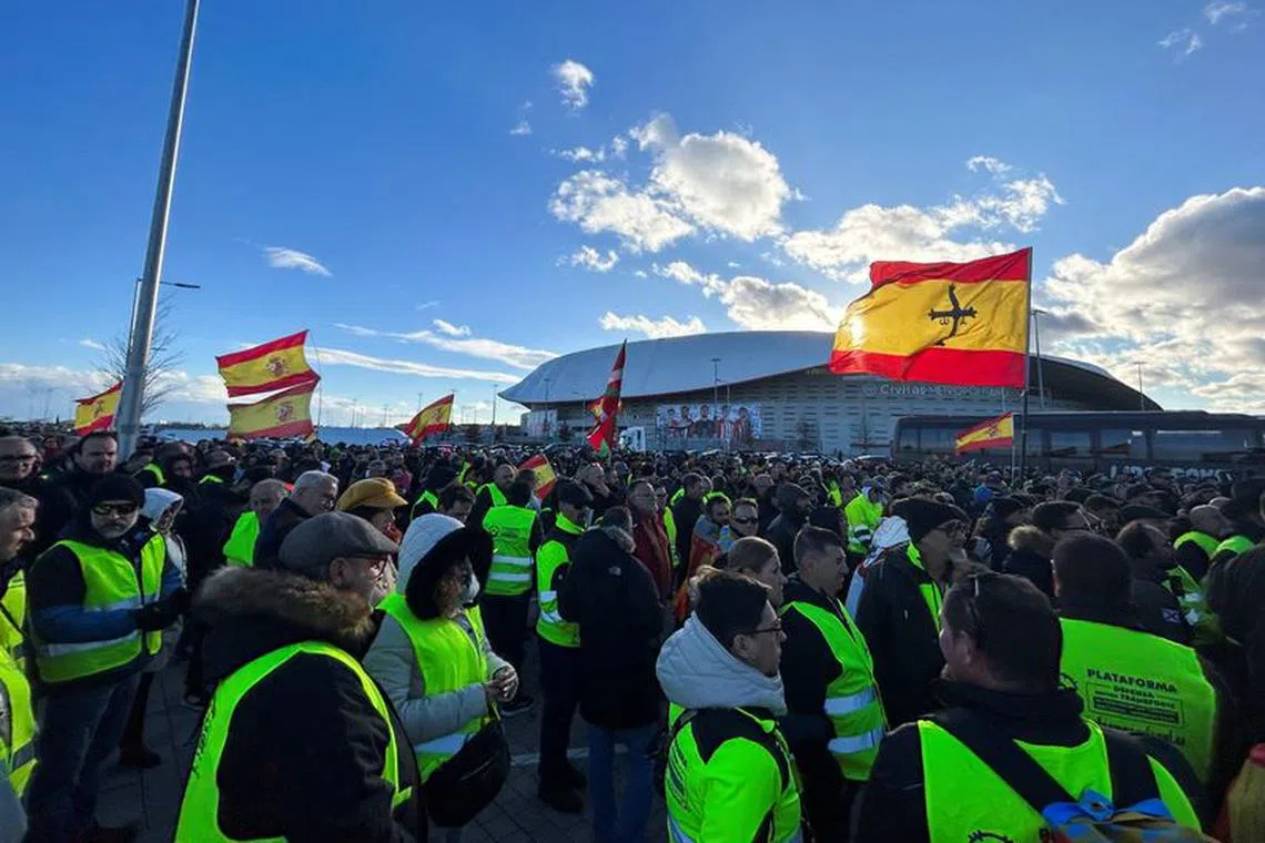Farmers and truck drivers gather outside Atletico Madrid stadium to vote a strike in both sectors during a fifth day of protests across the country, in Madrid, Spain. February 10, 2024. REUTERS/Catarina Demony