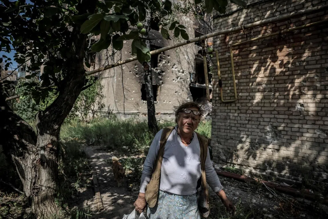A local resident walking near residential buildings heavily damaged by Russian attacks in the front-line town of Chasiv Yar, in Ukraine's Donetsk region, on Sept 2.