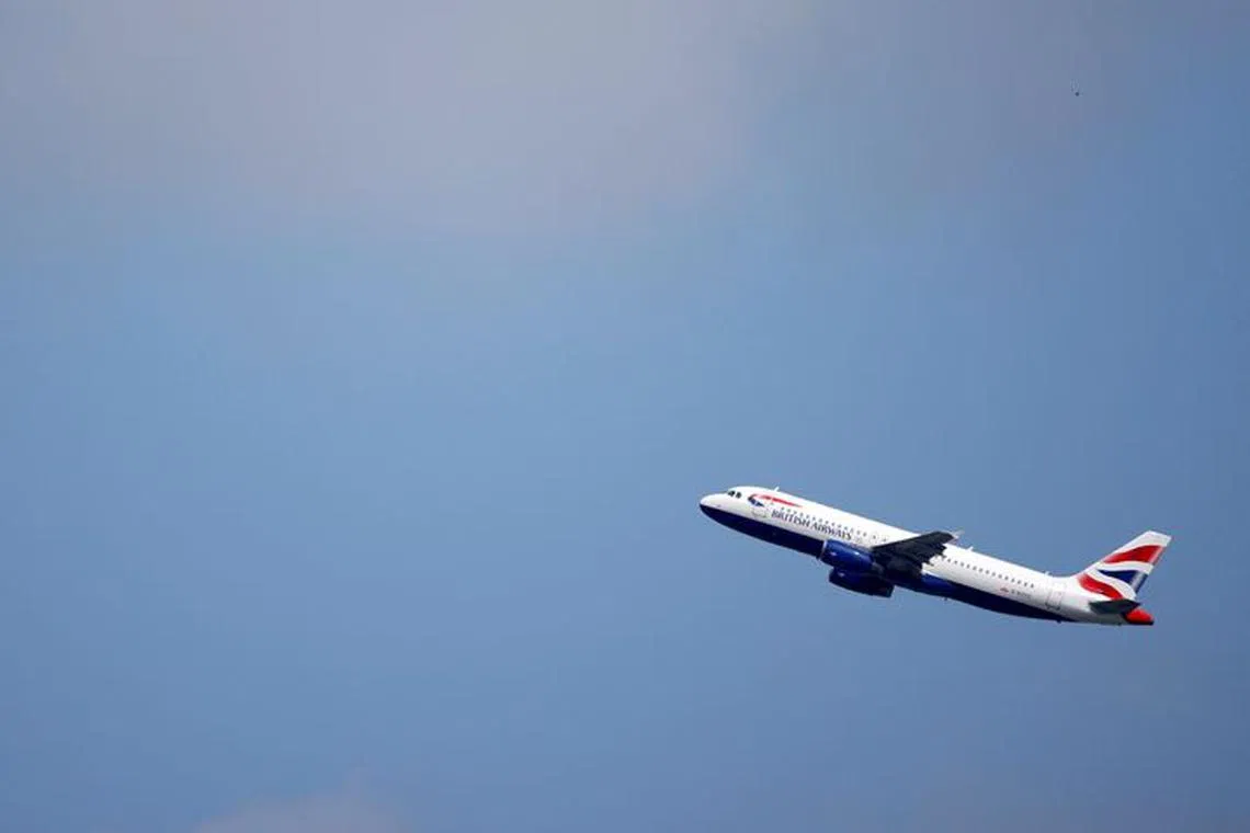 FILE PHOTO: British Airways Airbus A320 aircraft takes off from Heathrow Airport in London, Britain, May 17, 2021. REUTERS/John Sibley/File Photo