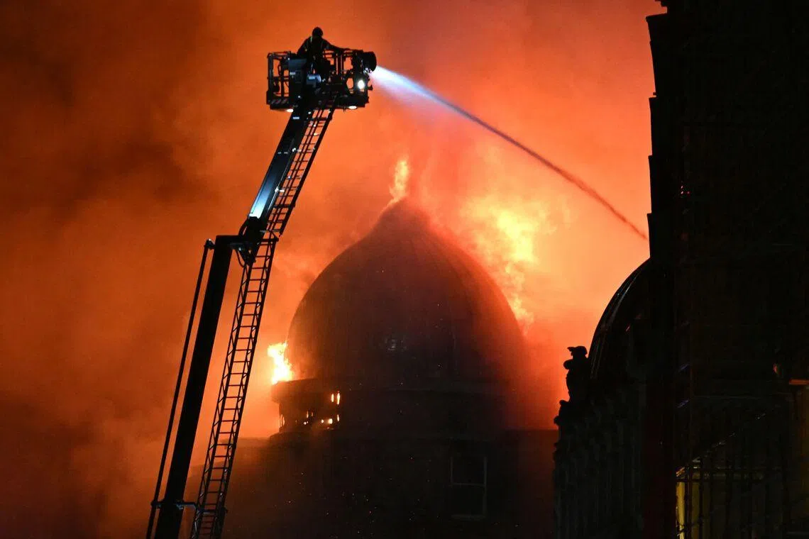 Fire fighters working to control a large fire in Glasgow City centre in Scotland on March 8, 2026. 