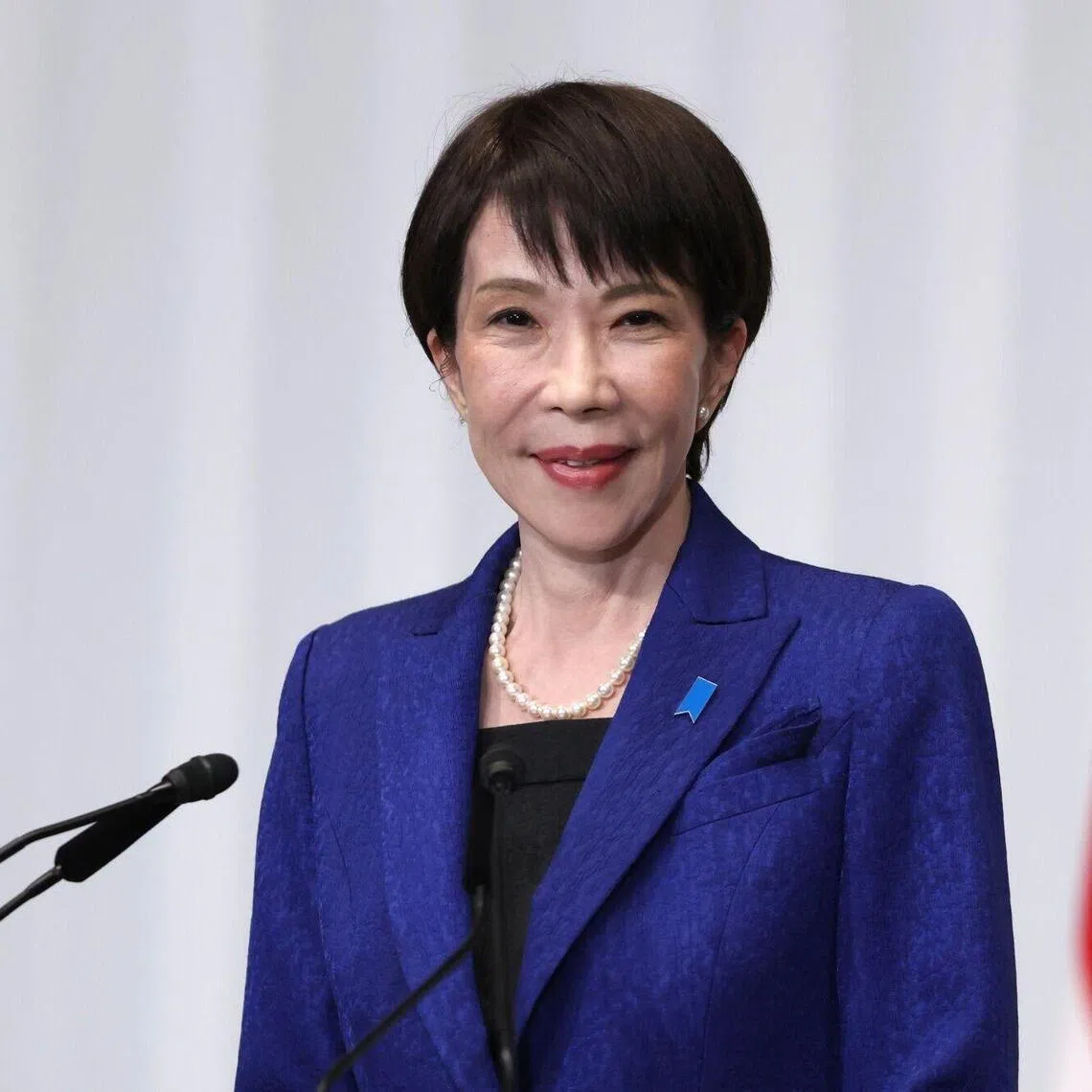Sanae Takaichi, Japan's prime minister and president of the Liberal Democratic Party (LDP), poses for a photograph ahead of a news conference at the party's headquarters in Tokyo, Japan, on Monday, Feb. 9, 2026. Takaichi’s ruling coalition secured an overwhelming majority in Sunday’s lower-house vote, giving her a clear mandate to pursue fiscal expansionary policies that have already driven Japanese stocks to all-time highs. Photographer: Kiyoshi Ota/Bloomberg