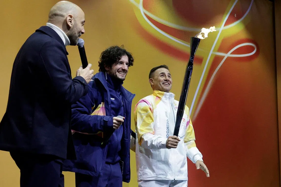 FILE PHOTO: 2026 Milano-Cortina Winter Olympics - 2026 Milano-Cortina Winter Olympics Torch Relay - Naples, Italy - December 23, 2025 Former Italian football player Fabio Cannavaro with the torch relay REUTERS/Ciro De Luca/File Photo