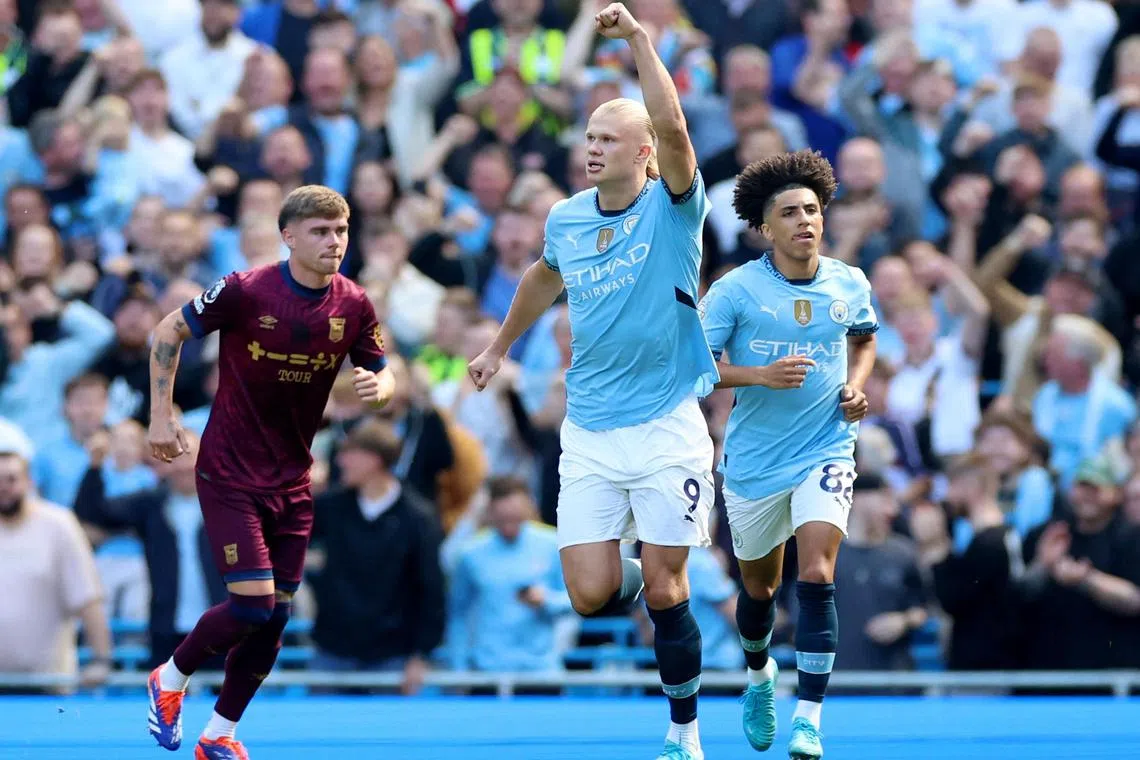 Manchester City striker Erling Haaland celebrates after scoring a penalty in the English Premier League match against Ipswich Town.