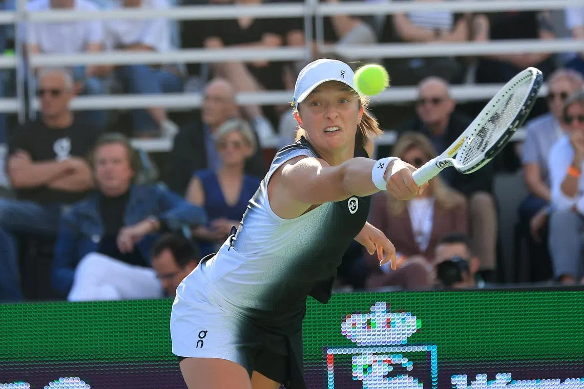 Poland's Iga Swiatek in action against Claire Liu of the US.