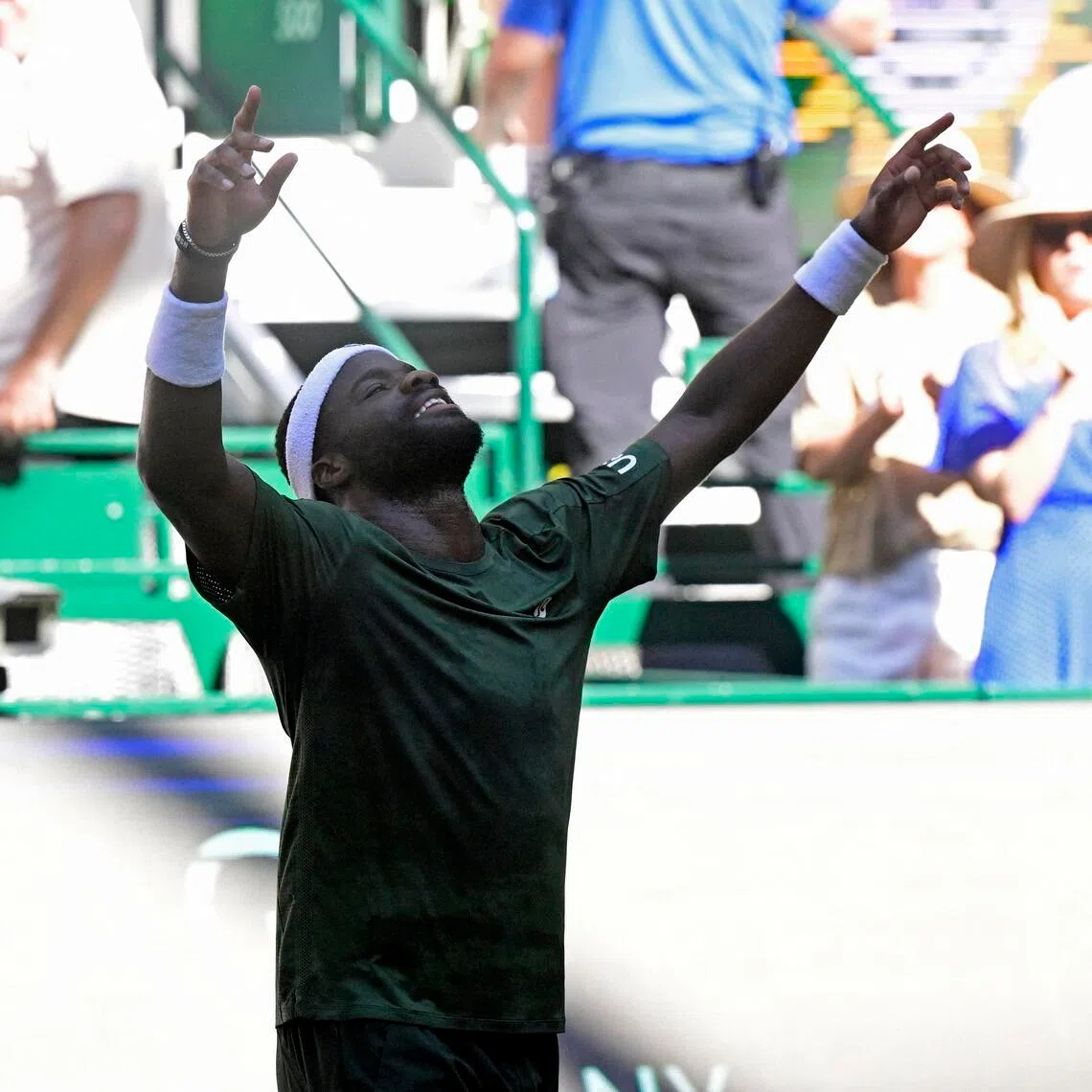 Frances Tiafoe of the US celebrates after countryman Taylor Fritz in the Halle Open final at the OWL Arena in Germany on June 21, 2026.