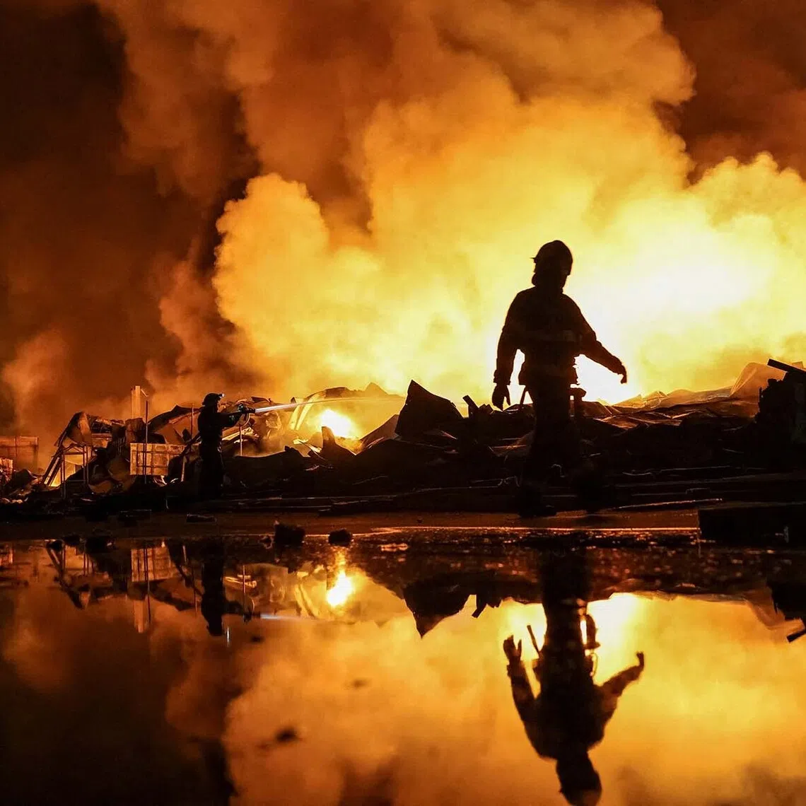 Firefighters work at a site of a Russian missile strike, amid Russia's attack on Ukraine, in Kyiv region, Ukraine, August 5, 2026. REUTERS/Anatolii Stepanov TPX IMAGES OF THE DAY