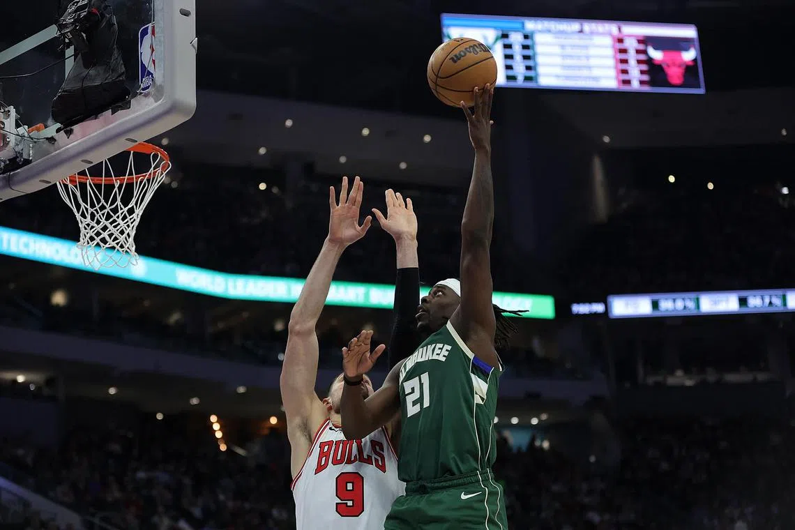 Jrue Holiday of the Milwaukee Bucks driving to the basket against Nikola Vucevi of the Chicago Bulls. The Bucks won 105-92.