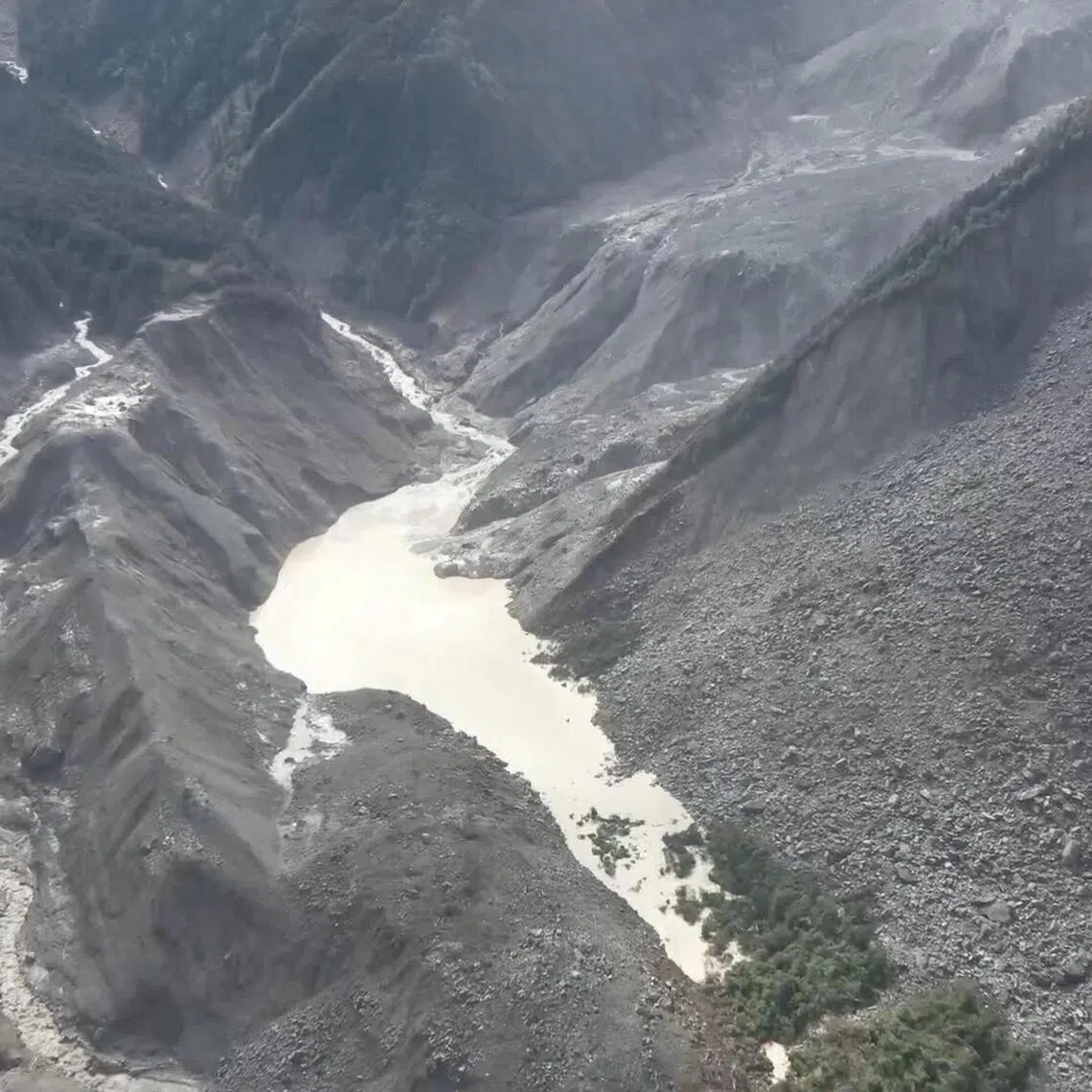 A drone view shows a barrier lake formed following a mudslide, in the border area between Tibet, China and Nepal on Aug 27.