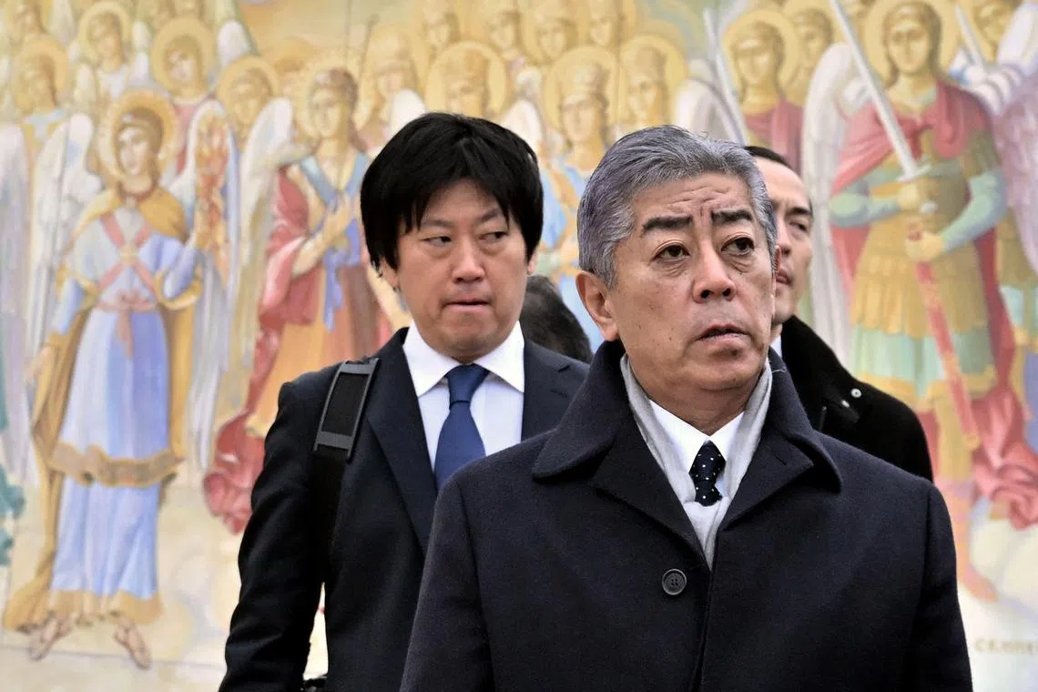 Japan's Foreign Minister, Mr Takeshi Iwaya (right), visiting Saint Michael's Cathedral in Kyiv, on Nov 16.