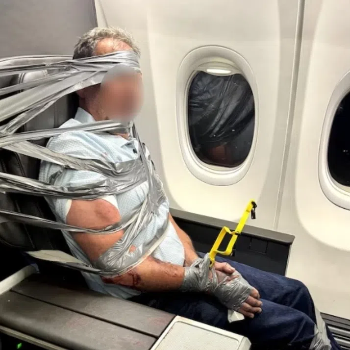 The disruptive man was restrained with zip ties and duct tape until the authorities could take him into custody.