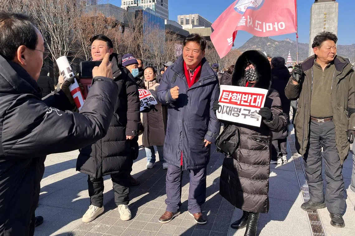Ko Sung-kook, a conservative commentator who hosts Kosungkook TV on YouTube, meets his fans during a rally to support President Yoon Suk Yeol in Seoul, South Korea, December 14, 2024.    REUTERS/Ju-min Park