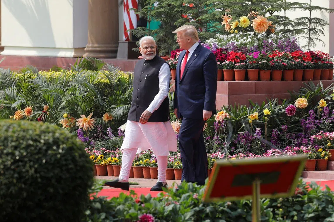 FILE PHOTO: U.S. President Donald Trump and India's Prime Minister Narendra Modi arrive for their joint news conference at Hyderabad House in New Delhi, India, February 25, 2020. REUTERS/Adnan Abidi/File Photo