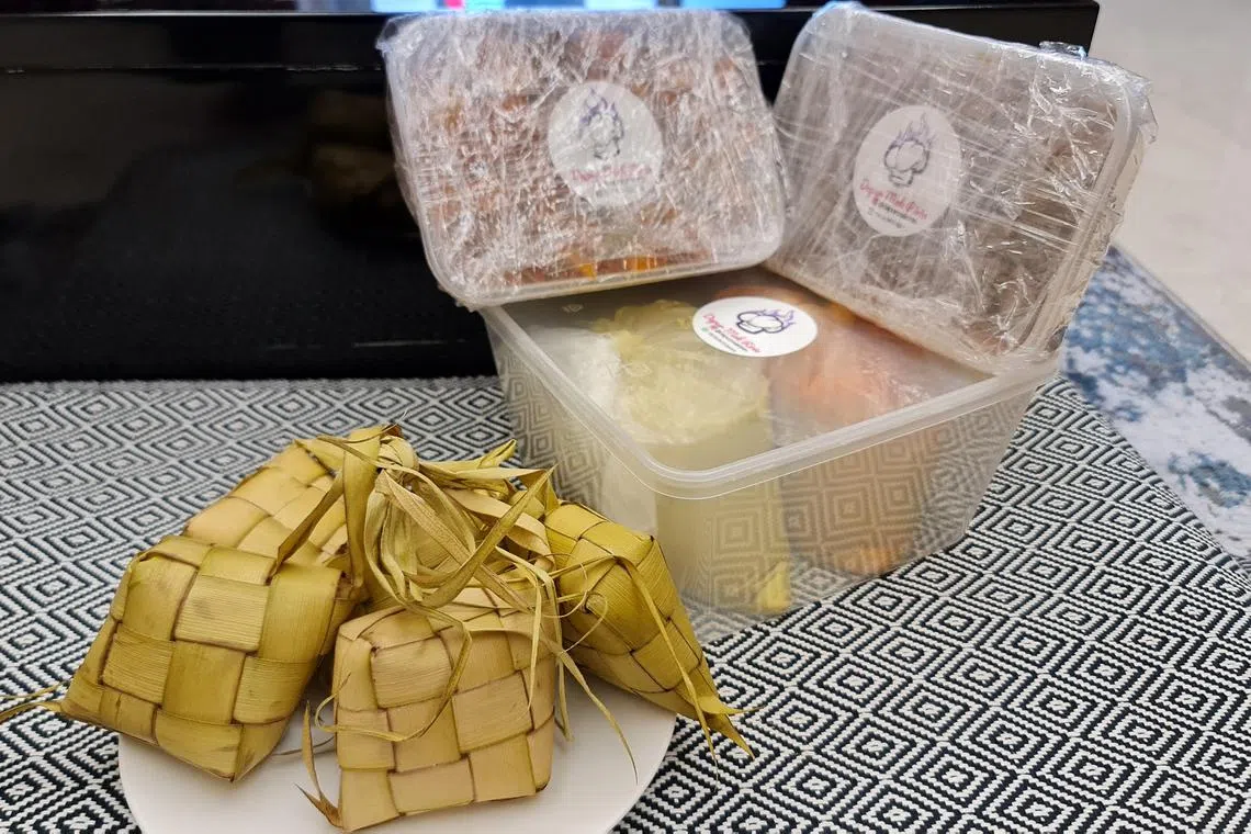 Ketupat rice cakes, beef rendang, chicken opor stew and mixed potato sambal goreng were ordered online.