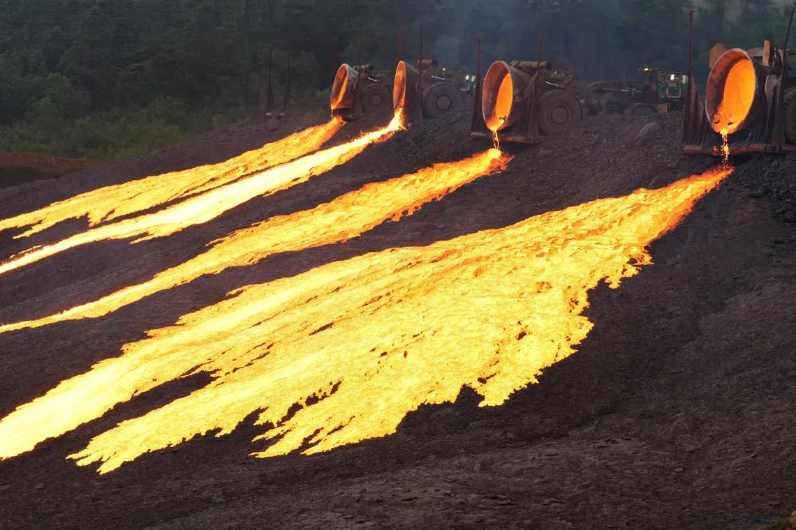 Hot slag flows from trucks to the dumping site at the nickel processing plant operated by PT Vale Indonesia in Sorowako, South Sulawesi province, Indonesia July 28, 2023, in this photo taken by Antara Foto. Antara Foto/Jojon/via REUTERS ATTENTION EDITORS - THIS IMAGE HAS BEEN SUPPLIED BY A THIRD PARTY. MANDATORY CREDIT. INDONESIA OUT. NO COMMERCIAL OR EDITORIAL SALES IN INDONESIA.     TPX IMAGES OF THE DAY     