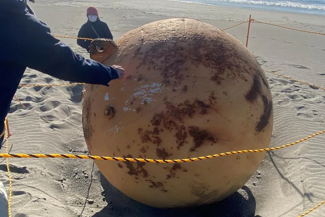 A ball is seen on a beach in Hamamatsu, Japan, on Feb 22, 2023.