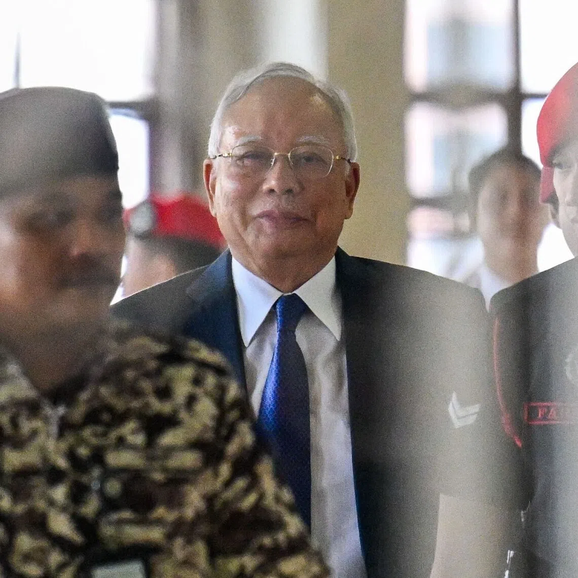 Former Malaysian PM Najib Razak faced 25 charges over allegations that roughly RM2.3 billion (S$727 million) was transferred into his personal bank accounts through a network of offshore entities.