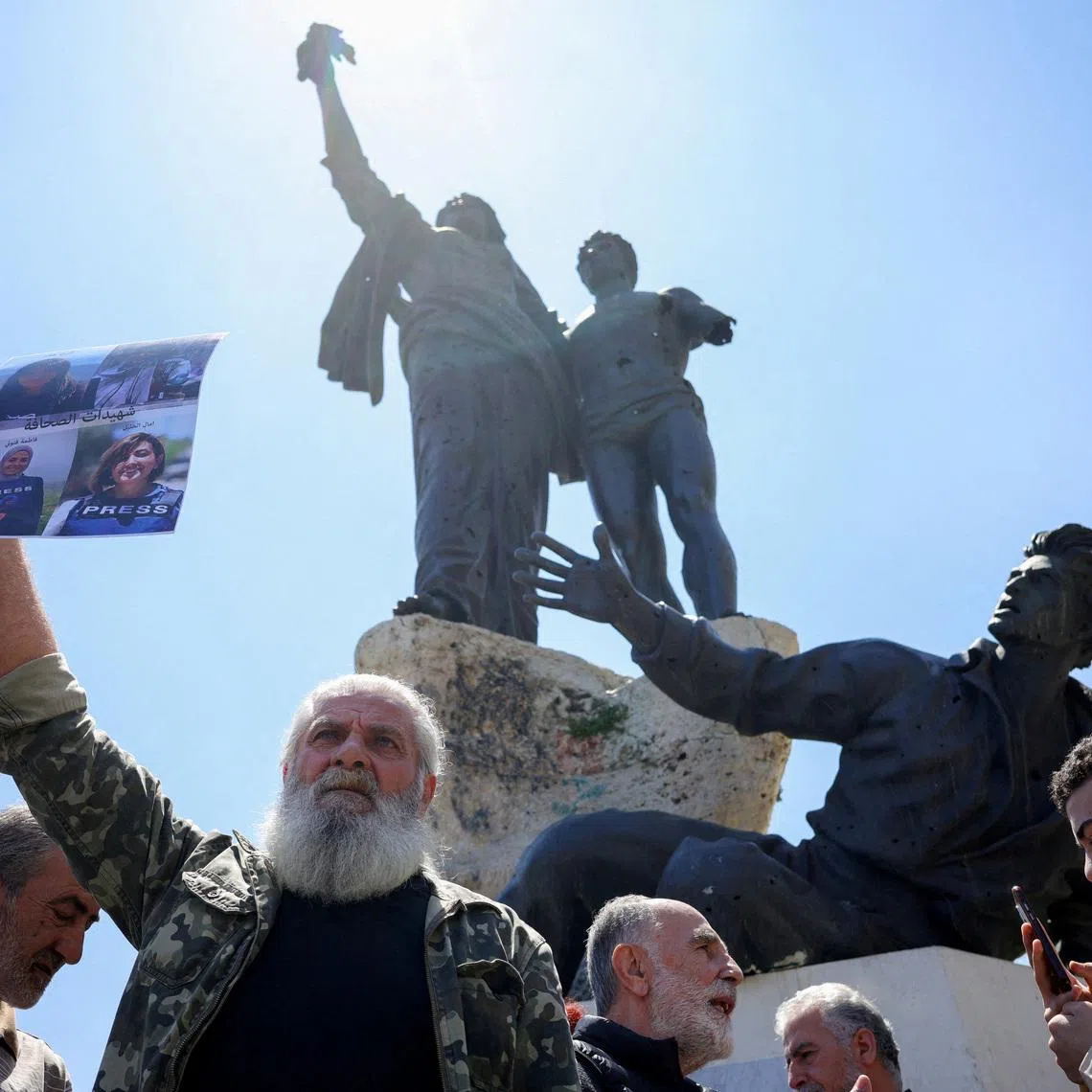 Protesters, including members of the media, attend a vigil to condemn the killing of journalists, a day after journalist Amal Khalil was killed in an Israeli strike, in Martyrs' Square, Beirut, Lebanon April 23, 2026. REUTERS/Marko Djurica TPX IMAGES OF THE DAY