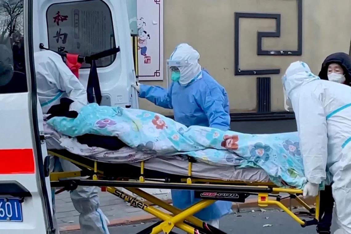 Medical staff stretcher a patient into a fever clinic at Chaoyang Hospital in Beijing, China earlier this week.