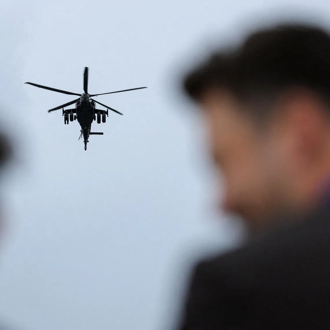 People watch the presentation of Leonardo Helicopters AW249 Fenice attack helicopter as part of the International Aerospace Exhibition ILA at Schoenefeld Airport in Berlin, Germany, June 10, 2026. REUTERS/Fabrizio Bensch