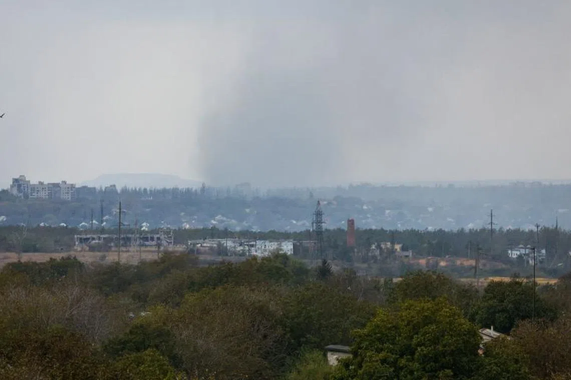 FILE PHOTO: Smoke rises above the area of Avdiivka town in the course of Russia-Ukraine conflict, as seen from Yasynuvata (Yasinovataya) in the Donetsk region, Russian-controlled Ukraine, October 13, 2023. REUTERS/Alexander Ermochenko