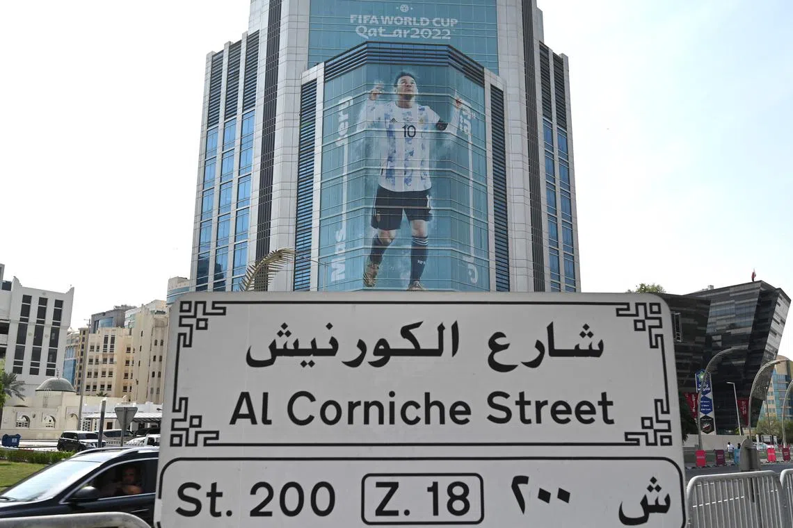 A large picture of Argentina's captain Lionel Messi is displayed on a building in Doha on Nov 6, 2022.