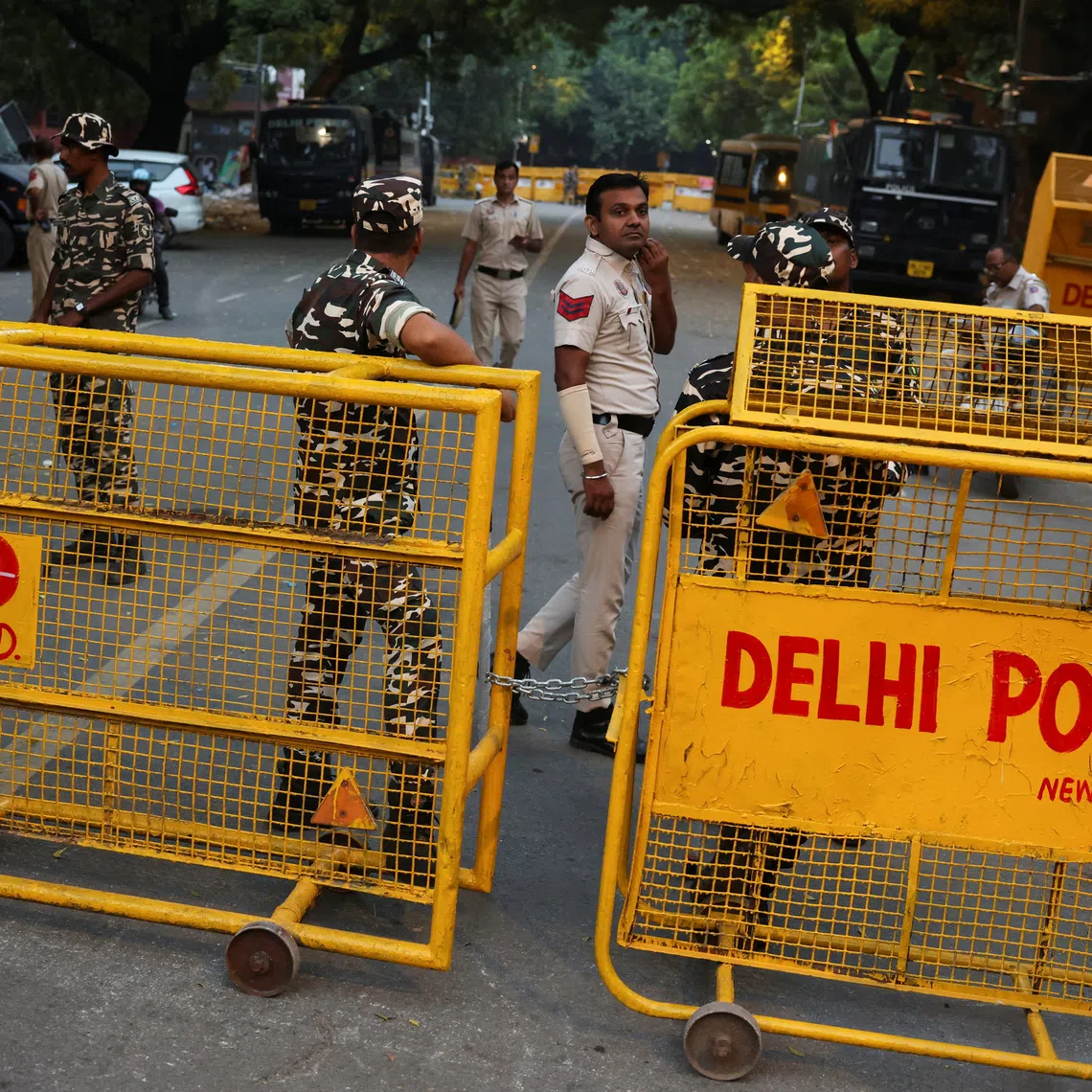 Security personnel stand next to barricades ahead of a protest planned by the Cockroach Janta Party near Jantar Mantar in New Delhi on Oct 9.