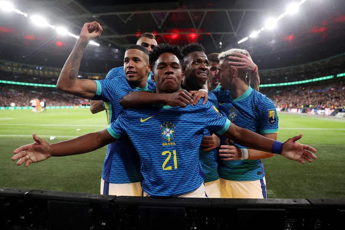 FILE PHOTO: Soccer Football - International Friendly - England v Brazil - Wembley Stadium, London, Britain - March 23, 2024 Brazil's Endrick celebrates scoring their first goal with Vinicius Junior and team mates REUTERS/Carl Recine/File Photo