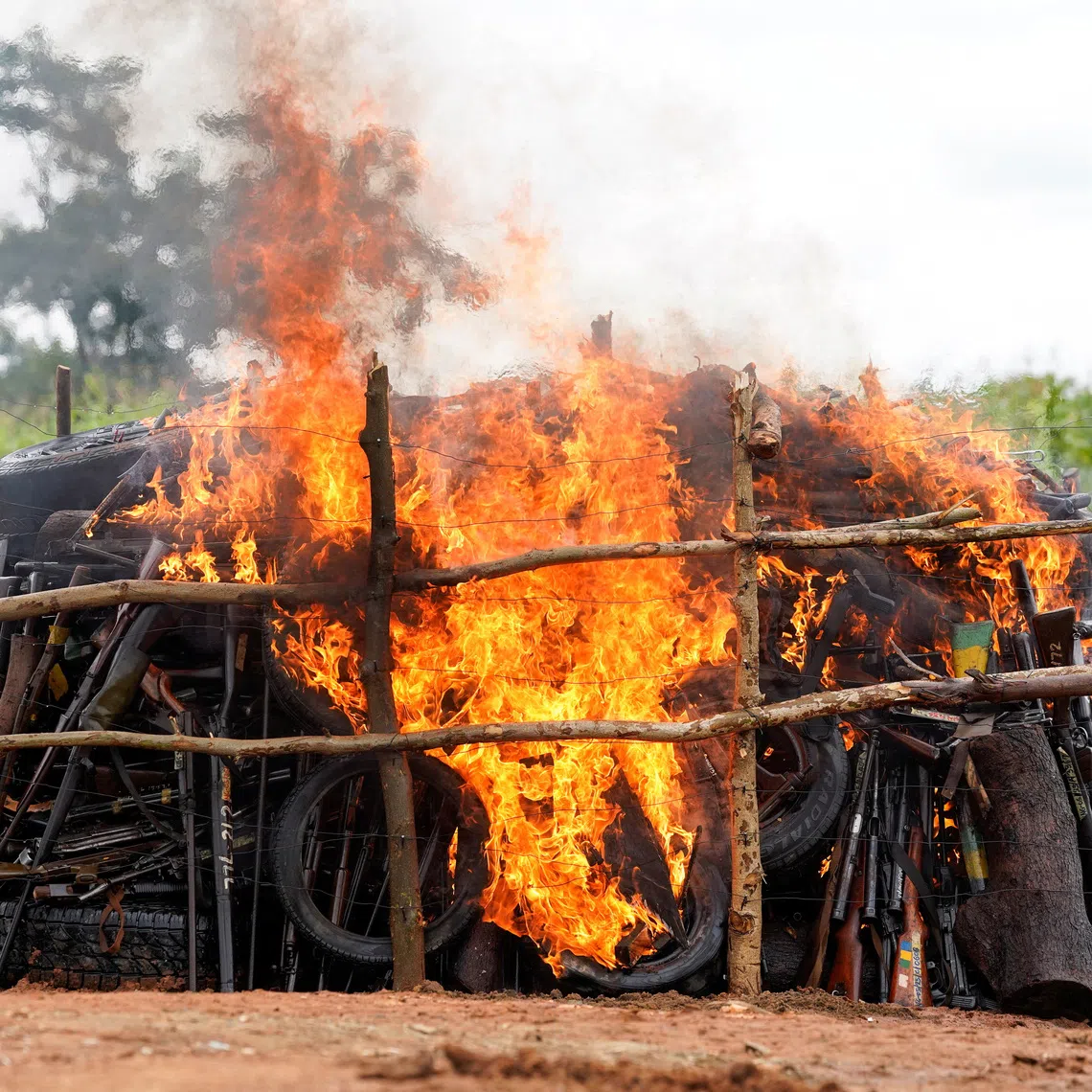 Recovered, illicitly acquired, decommissioned and unserviceable firearms burn during a public destruction exercise organised by the National Centre for the Control of Small Arms and Light Weapons in Abuja, Nigeria, July 30, 2026. REUTERS/Marvellous Durowaiye