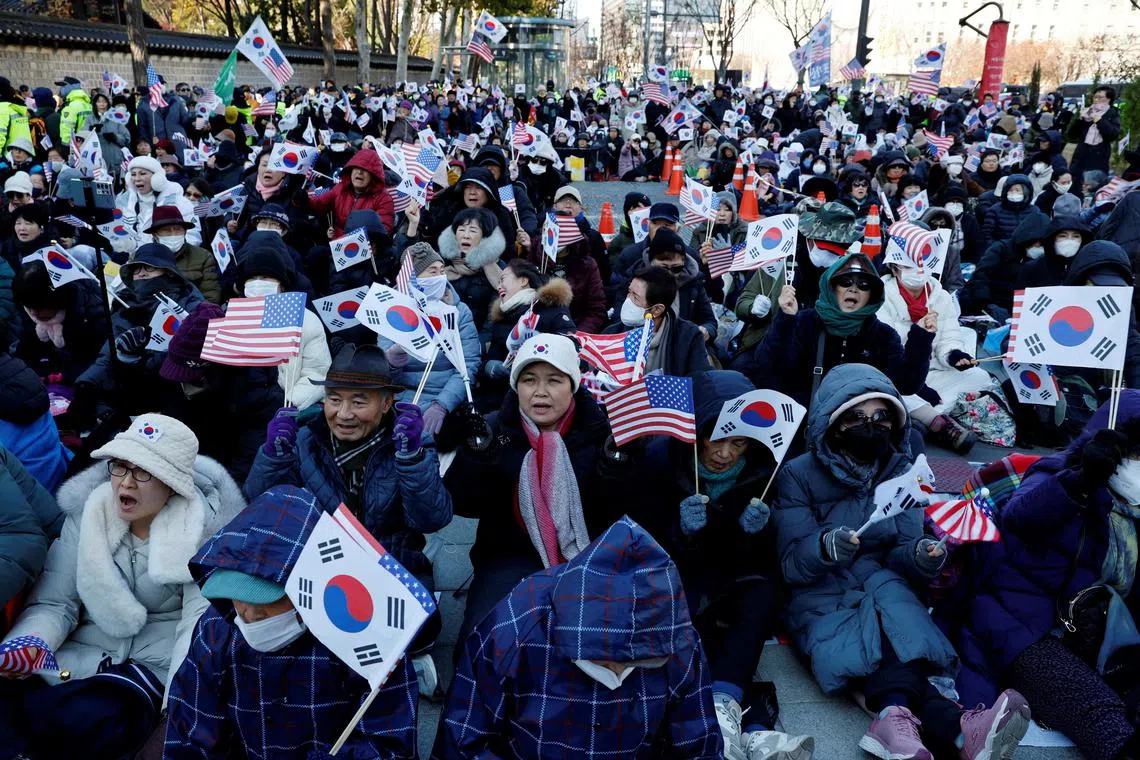 Protesters from conservative groups attend a rally supporting South Korean President Yoon Suk Yeol and denouncing opposition party's politicians after the President's surprise declaration of the martial law last night, which was reversed hours later in Seoul, South Korea, December 4, 2024.   REUTERS/Kim Kyung-Hoon