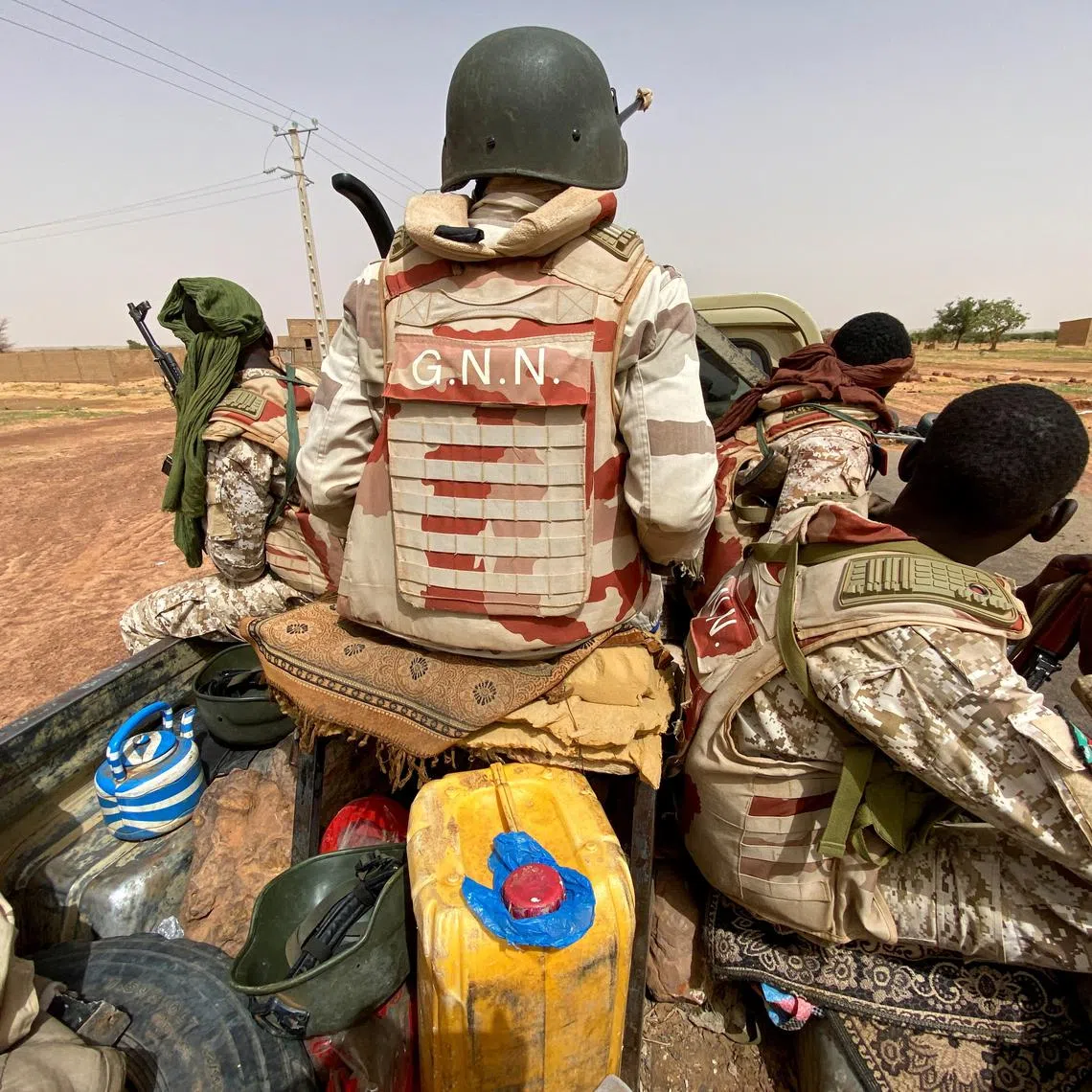 FILE PHOTO: A convoy of Nigerien soldiers patrol outside the town of Ouallam, Niger, July 6, 2021. Picture taken July 6, 2021.  REUTERS/Media Coulibaly/File Photo