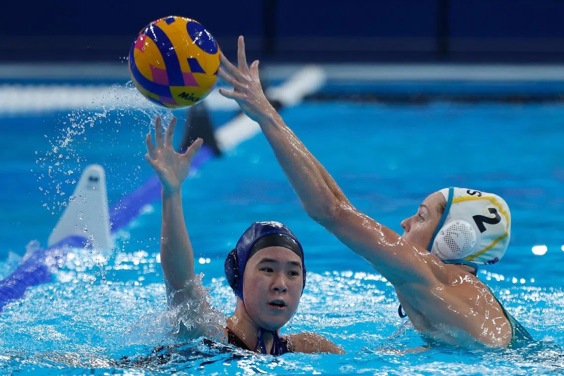 Singapore water polo captain Abielle Yeo defends against Keesja Gofers of Australia in the 2024 World Aquatics Championships in Doha.