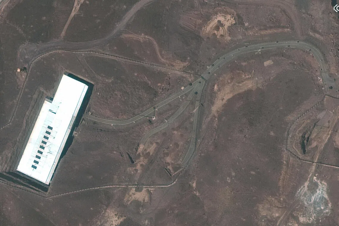 A satellite view showing an overview of Iran’s Fordow underground enrichment plant, with obstacles on a road, near Qom, Iran, on June 21.