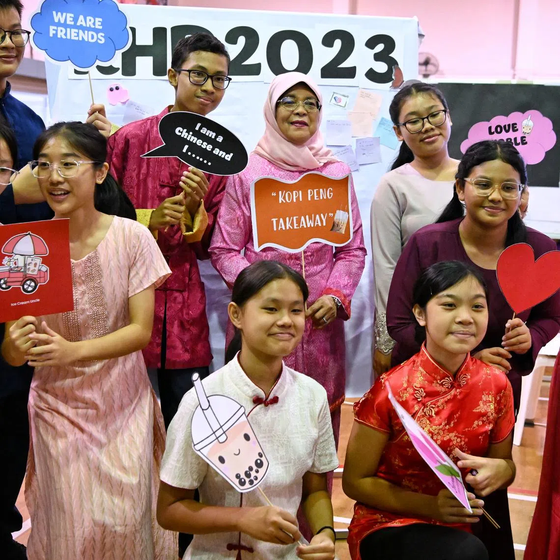 President Halimah Yacob with students at a photo booth during her visit to Northbrooks Secondary School on July 20.