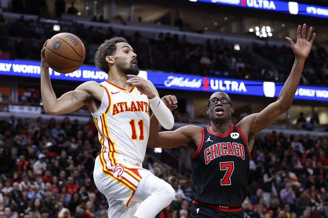 Nov 22, 2024; Chicago, Illinois, USA; Atlanta Hawks guard Trae Young (11) looks to pass the ball against Chicago Bulls forward Jalen Smith (7) during the second half at United Center. Mandatory Credit: Kamil Krzaczynski-Imagn Images/ File Photo