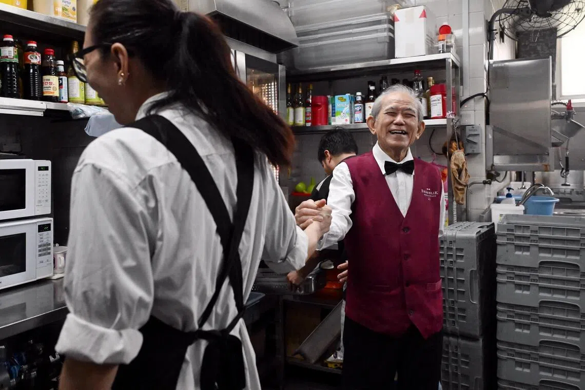 Foo has a good relationship with most of his colleagues, often smiling and joking with them.