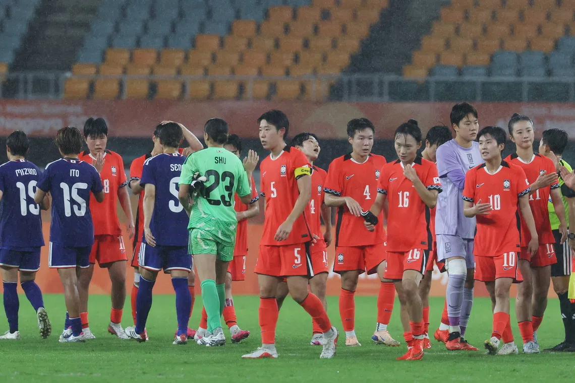 South Korean players react after losing to Japan in the women’s football semi-final match at the Aichi-Nagoya Asian Games on Sept 29.