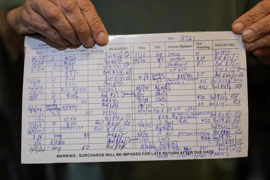 Better than issuing receipts: Handwritten video rental cards used to track DVD or video borrowing at Rida Video Centre.