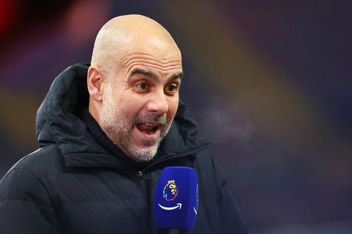 Soccer Football - Premier League - Aston Villa v Manchester City - Villa Park, Birmingham, Britain - December 6, 2023  Manchester City manager Pep Guardiola being interviewed before the match Action Images via Reuters/Andrew Boyers/ File photo