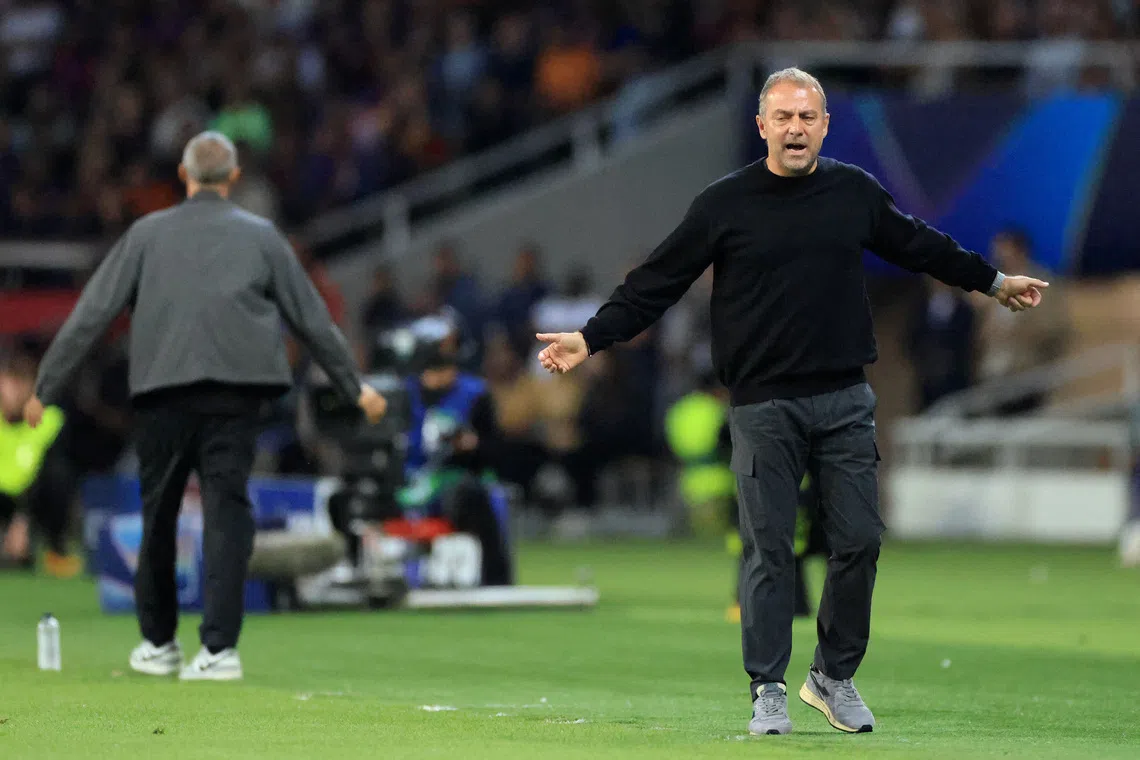 Soccer Football - UEFA Champions League - FC Barcelona v Paris St Germain - Estadi Olimpic Lluis Companys, Barcelona, Spain - October 1, 2025 FC Barcelona coach Hansi Flick reacts REUTERS/Nacho Doce
