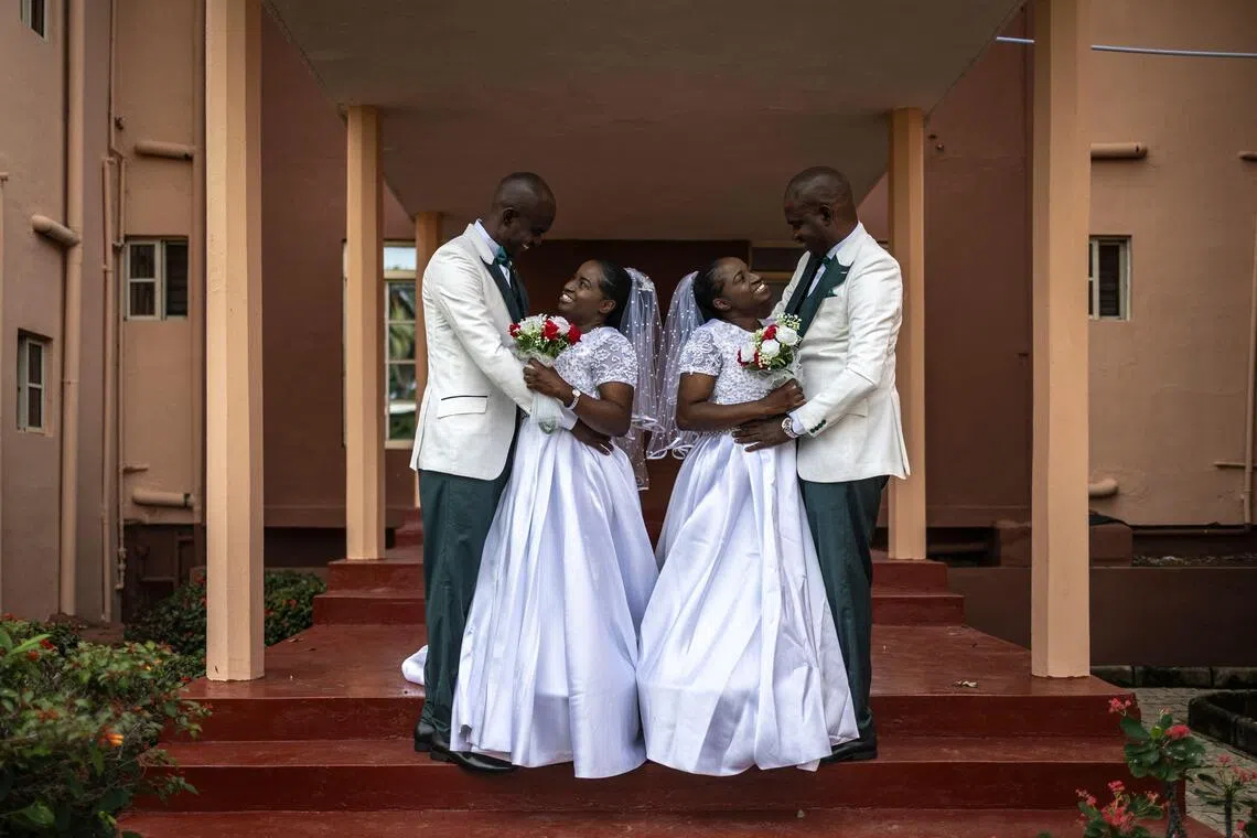 Kehinde Oguntoye and Kehinde Adediran (both left) with their twins Taiwo Adediran and Taiwo Oguntoye (both right), before their double wedding in Ibadan, Nigeria, on June 20.