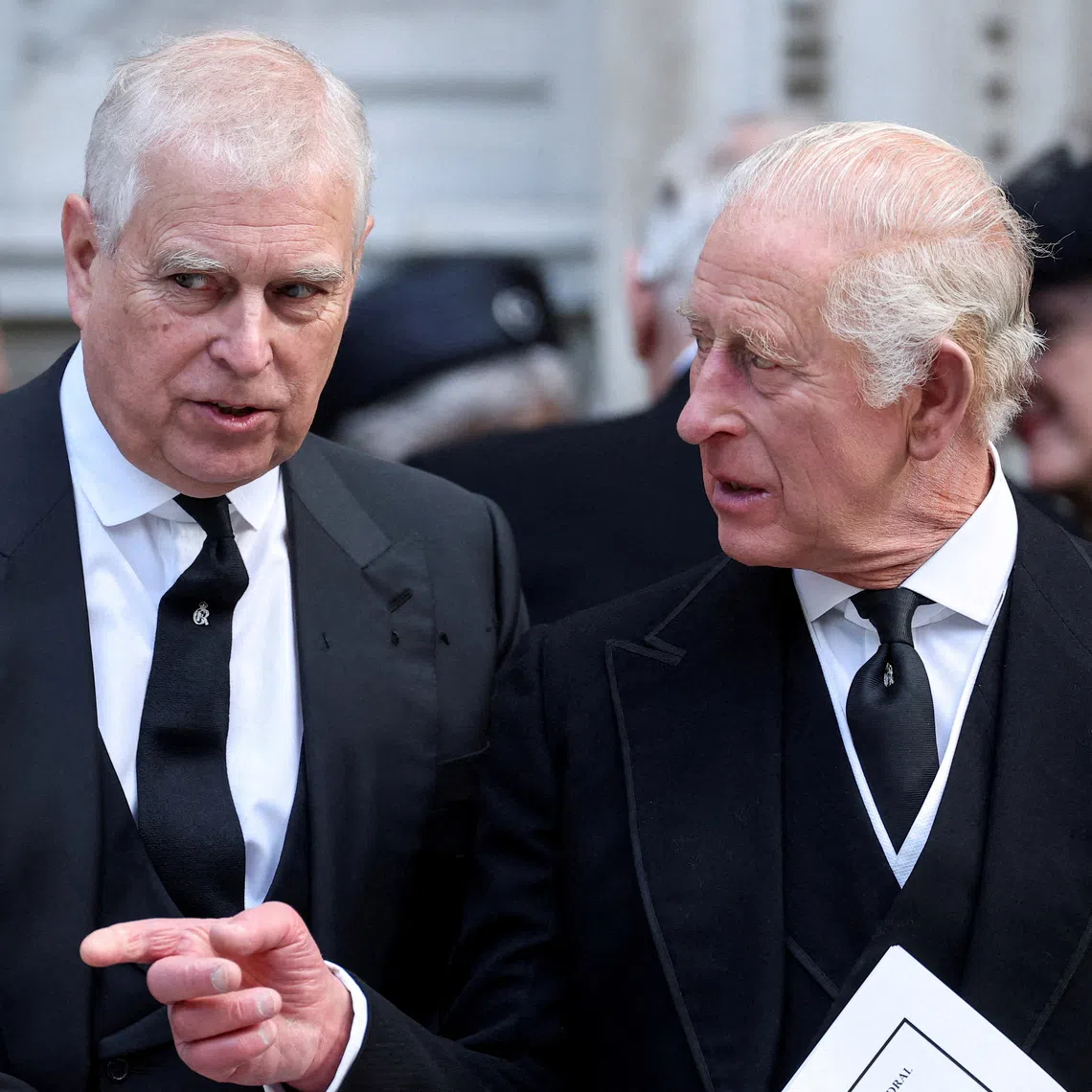 FILE PHOTO: Britain's Prince Andrew speaks with King Charles as they leave Westminster Cathedral at the end of the Requiem Mass, on the day of the funeral of Britain's Katharine, Duchess of Kent, in London, Britain, September 16, 2025. REUTERS/Toby Melville/File Photo