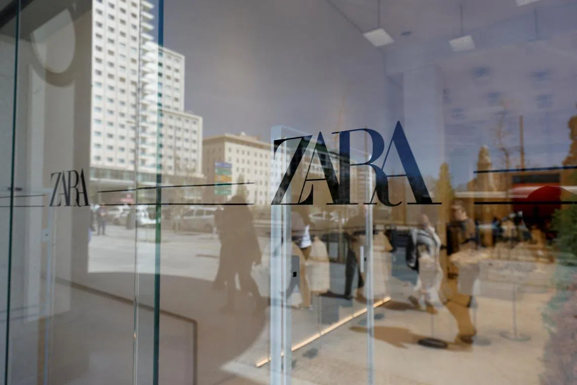 FILE PHOTO: Zara's logo is displayed on a window, at one of the company's largest stores in the world, in Madrid, Spain, April 7, 2022. REUTERS/Juan Medina/File Photo