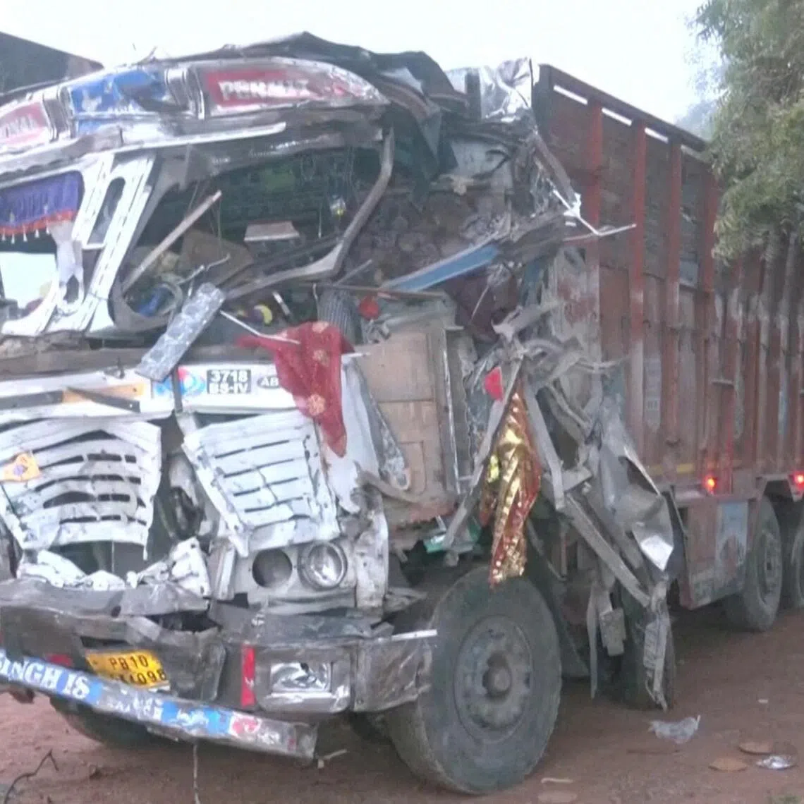 The damaged front body of the truck that lost control and ran over people in Gwalior, India, on Oct 18.