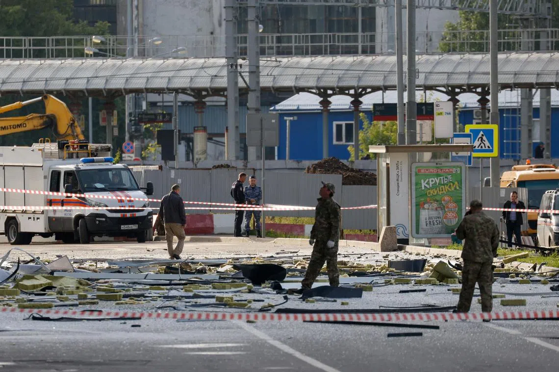State news agencies said drone fragments were found 2km away from Russia's defence ministry buildings.