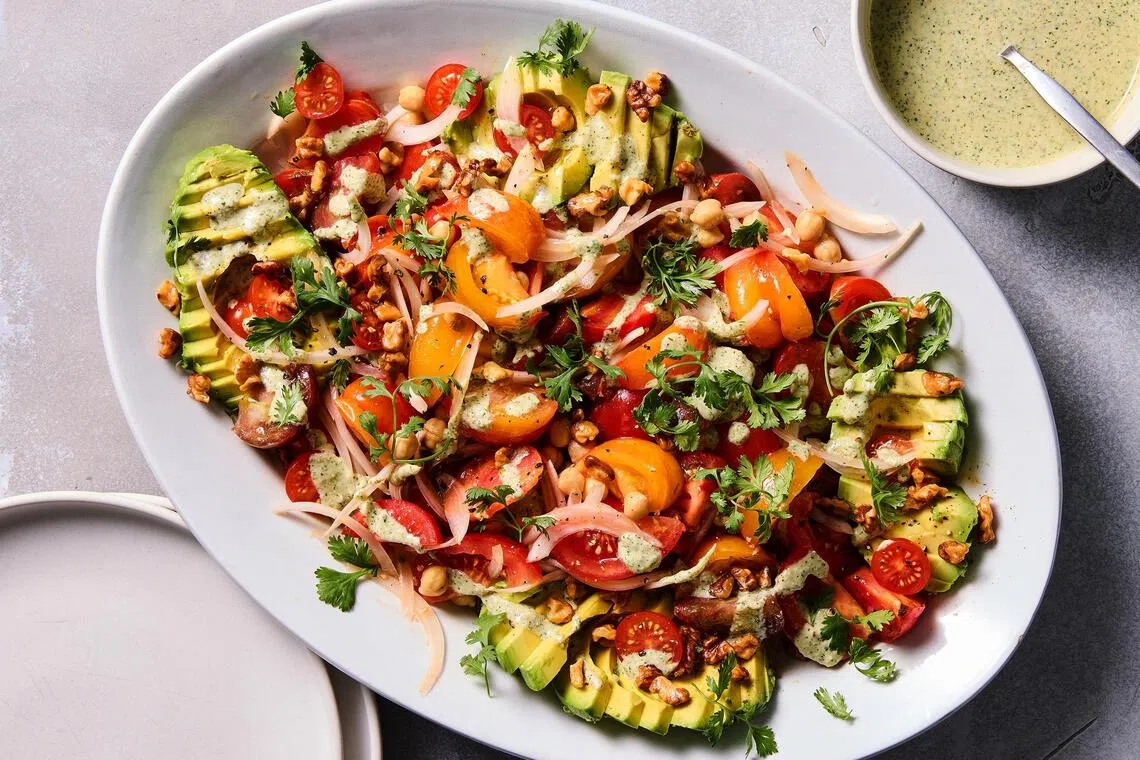 Tomato avocado salad with creamy feta dressing.