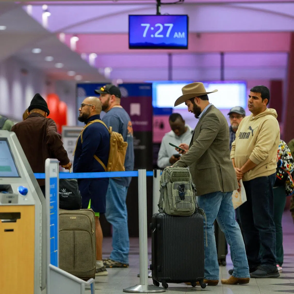 Passengers queue at El Paso International Airport after the U.S. Federal Aviation Administration lifted its temporary closure of the airspace over El Paso, saying all flights will resume as normal and that there was no threat to commercial aviation, in El Paso, Texas, U.S., February 11, 2026. REUTERS/Jose Luis Gonzalez