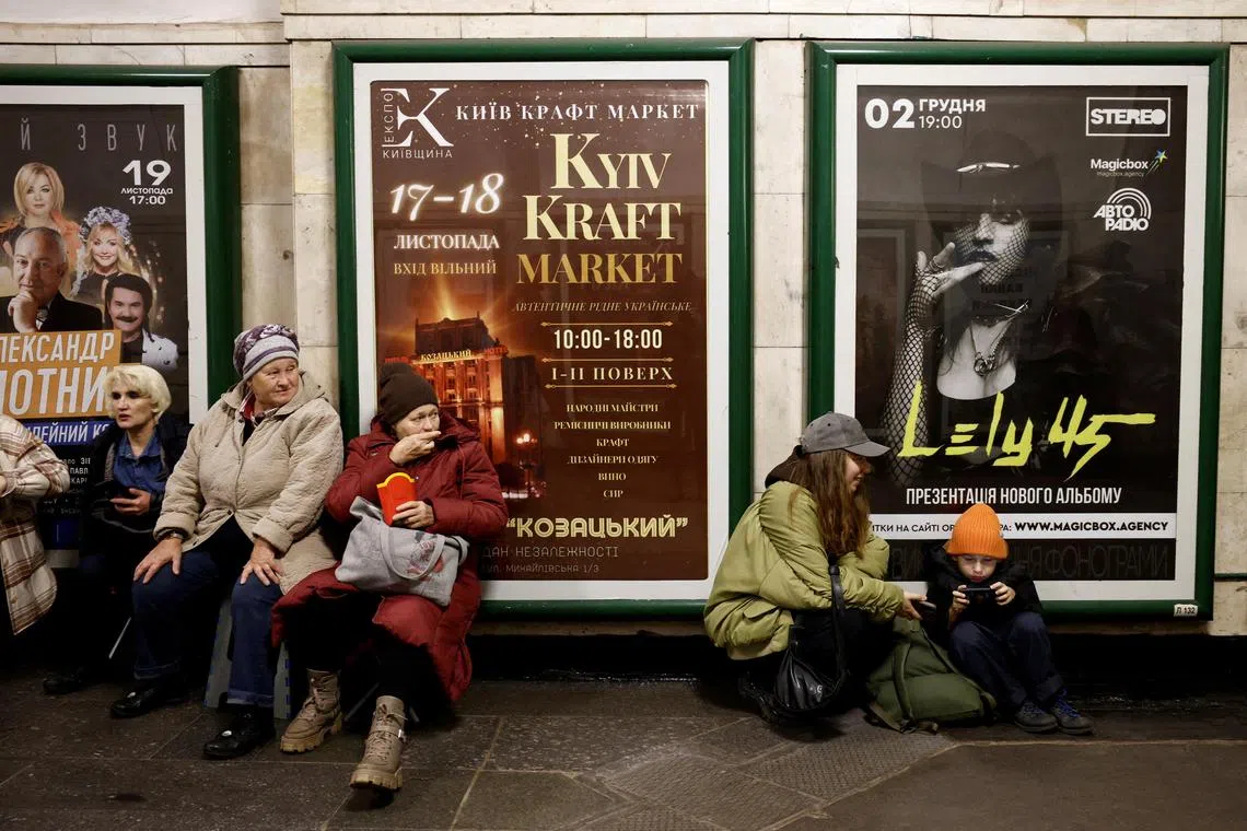 People take shelter amid an air raid in a Kyiv metro station. 