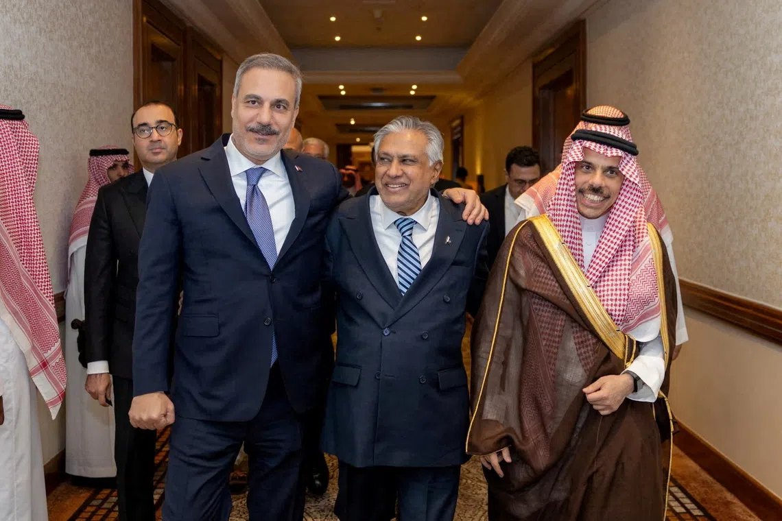 FILE PHOTO: Turkey's Foreign Minister Hakan Fidan, Pakistan's Deputy Prime Minister and Foreign Minister Mohammad Ishaq Dar and Saudi Arabia's Foreign Minister Prince Faisal bin Farhan Al Saud leave after a committee meeting of Mecca defence pact in Riyadh, Saudi Arabia, October 5, 2026. Turkish Foreign Ministry/Handout via REUTERS/File Photo